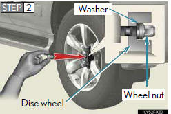Install the spare tire and loosely tighten each nut by hand to approximately