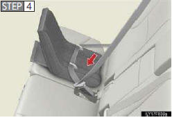 While pushing the child restraint system down into the rear seat, allow the shoulder