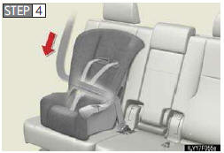 While pushing the child restraint system into the rear seat, allow the shoulder