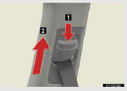 1. Push the seat belt shoulder anchor down while pressing the release