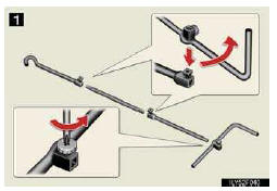 1. Loosen the bolt and the screw using either the jack handle end or a screwdriver.