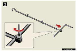 3. Assemble the jack handle extension bar and the jack han- dle and tighten the
