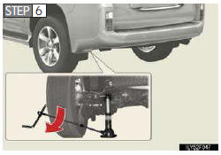 Raise the vehicle until the tire is slightly raised off the ground.