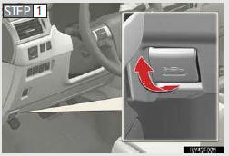 Move the auxiliary catch lever to side direction and lift the hood.