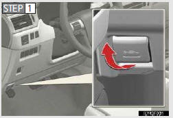 Move the auxiliary catch lever to side direction and lift the hood.