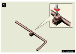 1 Loosen the screw using a