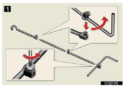 1. Loosen the bolt and the screw using either the jack handle end or a screwdriver.